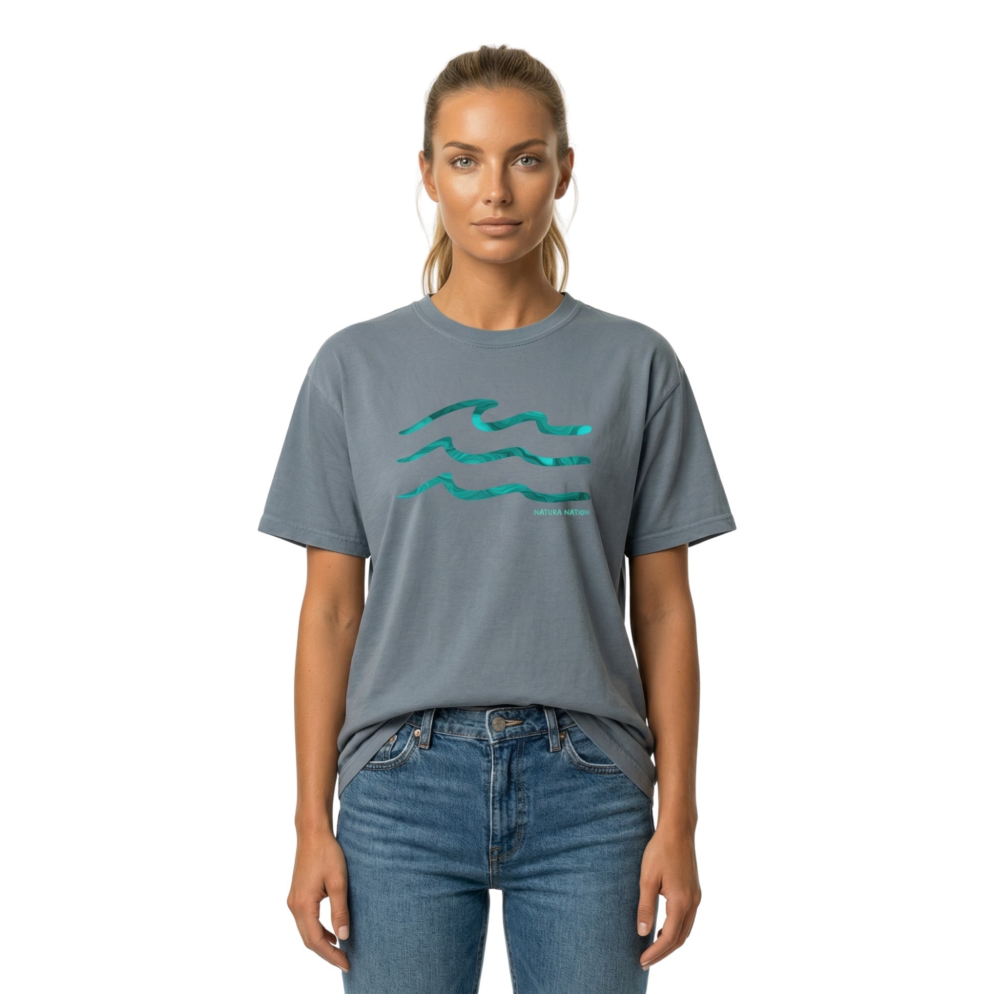 Women wearing a blue jeans Ocean T-Shirt featuring the Serenity Waves design. A deep Ocean Clothing piece for calm waters, made by Natura Nation.