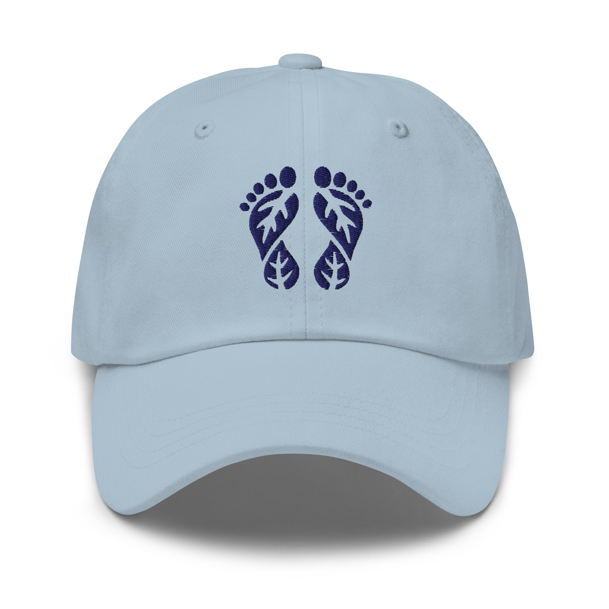 Light blue nature hat with the 'Natura's Footprints' embroidered logo. A serene Nature Dad Hat for calm and peaceful days. Essential Nature Clothing.