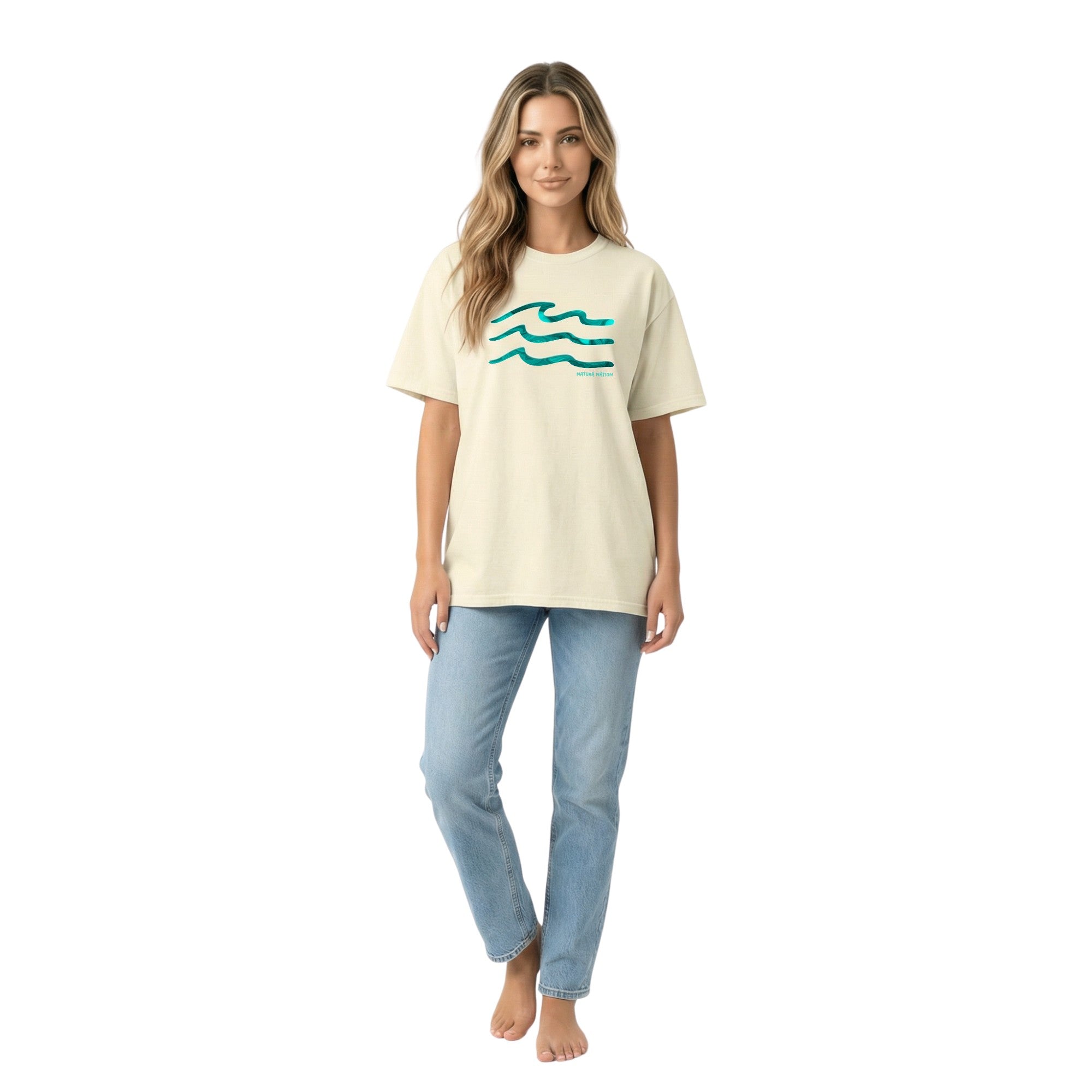 woman wearing a Chambray Ocean T-Shirt featuring the Serenity Waves design. This light Ocean Clothing is perfect for breezy coastal days by Natura Nation.