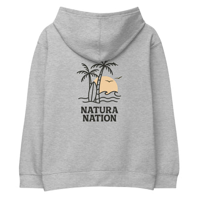 An athletic heather gray youth pullover hoodie shown from the back, featuring a graphic of two palm trees, a surfboard, a sunset, and the text 'NATURA NATION' in black. Youth tropical hoodie with a palm and sea design on the back for kids who love the beach.