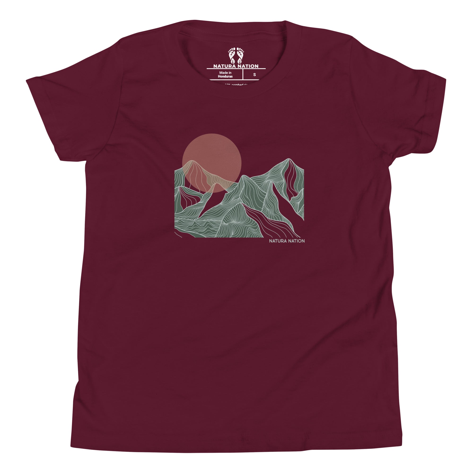 Kids mountain t-shirt, front view. A maroon short-sleeve crewneck t-shirt featuring a stylized line art graphic of mountains and a sun in muted green, pink, and brown tones on the chest, with a white 'Natura Nation' logo printed inside the collar.