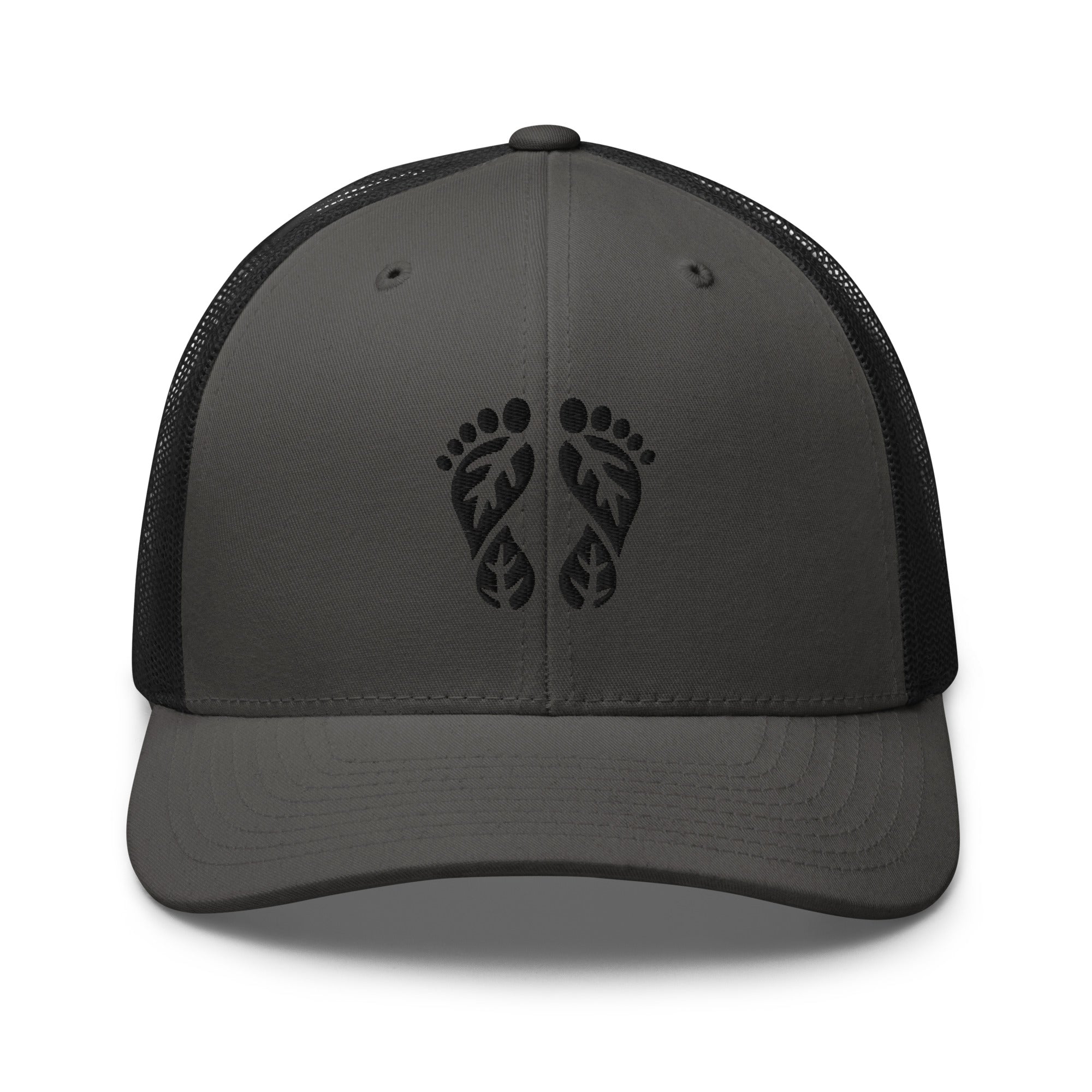 Charcoal and Black Nature Trucker Hat featuring 'Natura's Footprints' embroidery. A bold two-tone trucker hat for rugged outdoor style. Essential Nature Hats.