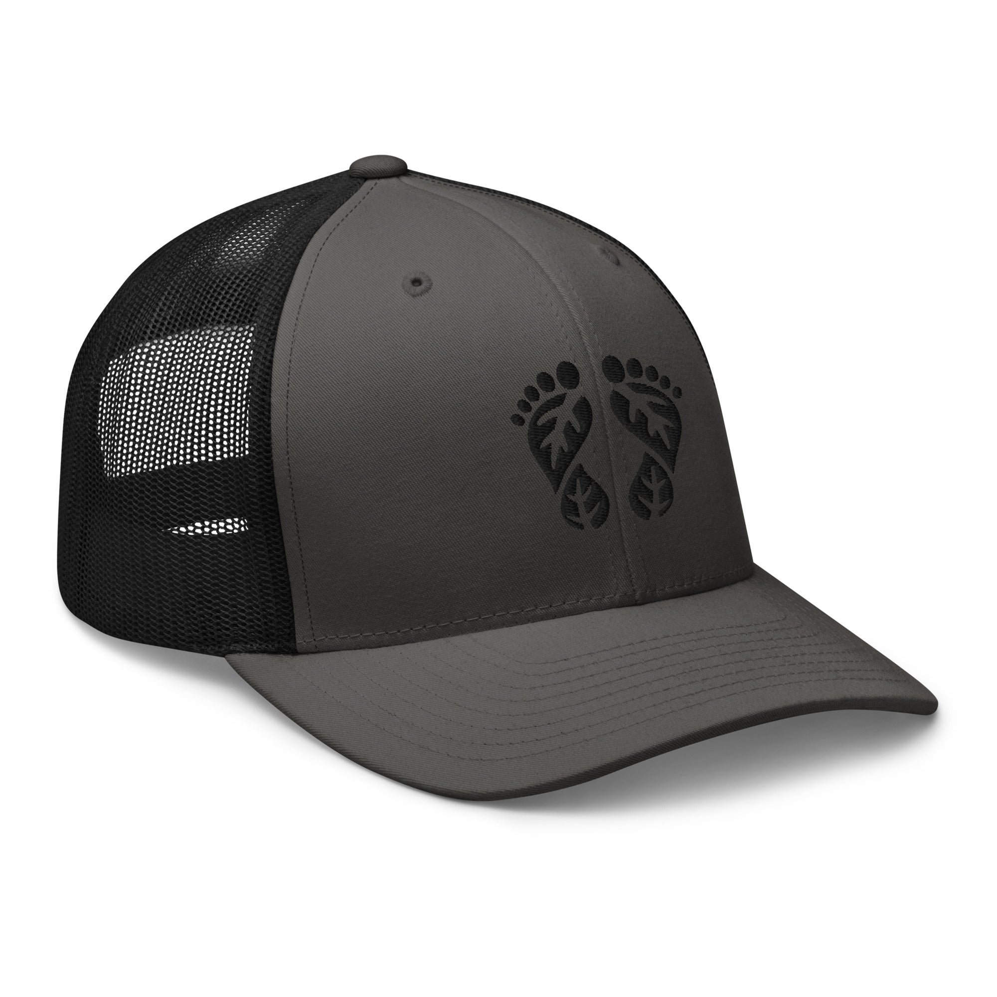 'Natura's Footprints' Charcoal and Black Trucker Hat: This powerful Nature Trucker Hat offers deep contrast. Explore our collection of striking trucker hats.