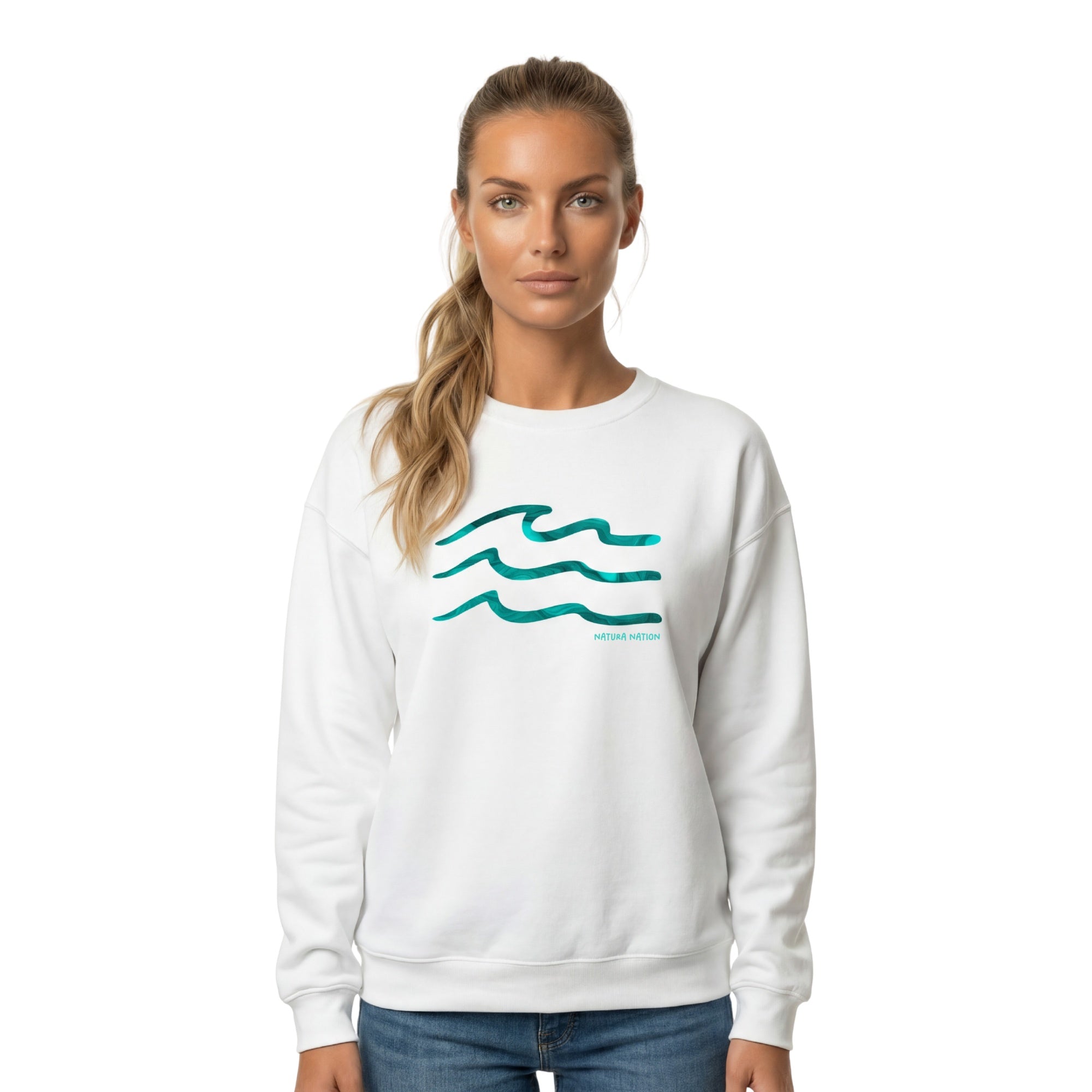 A female model wearing a white Serenity Waves sweatshirt featuring the 'Serenity Waves' design. This pristine Ocean Clothing is perfect for peaceful coastal days. Made by Natura Nation.