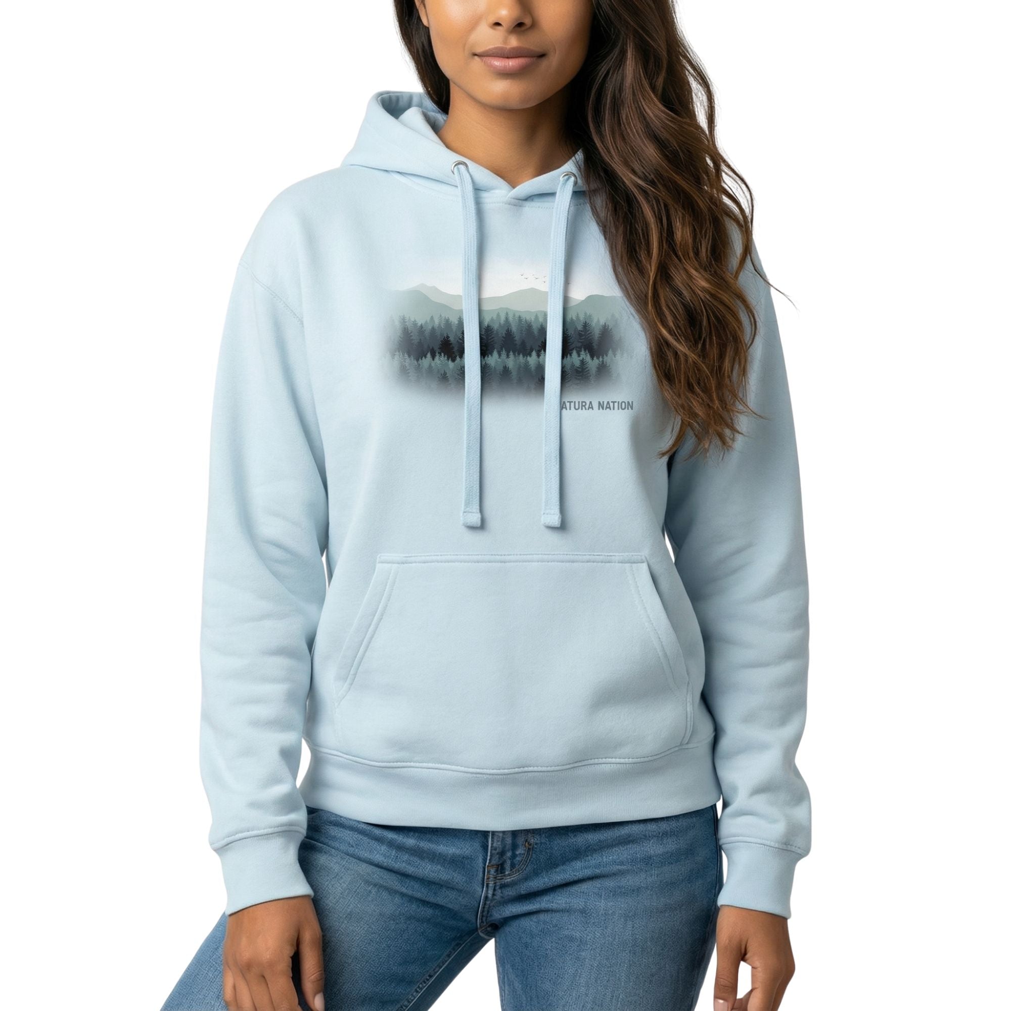 woman wearing a Sky Blue Tree hoodie with 'Pines and Peaks Harmony' graphic, a vibrant piece of Trees Clothing made by Natura Nation.