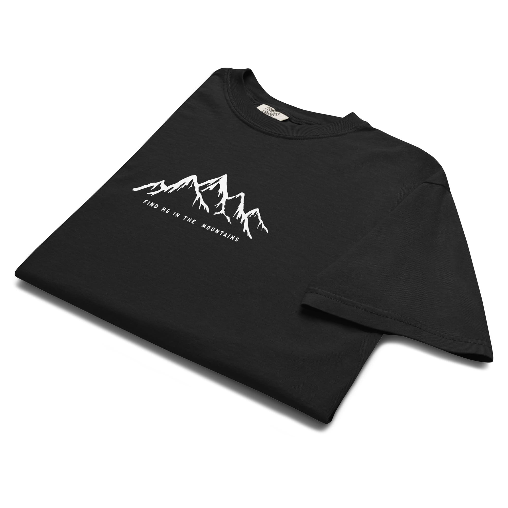 Black mountain T-shirt with a 'Find Me In The Mountains' design. Perfect mountain clothing for bold explorers, nature lovers, and mountain lovers.