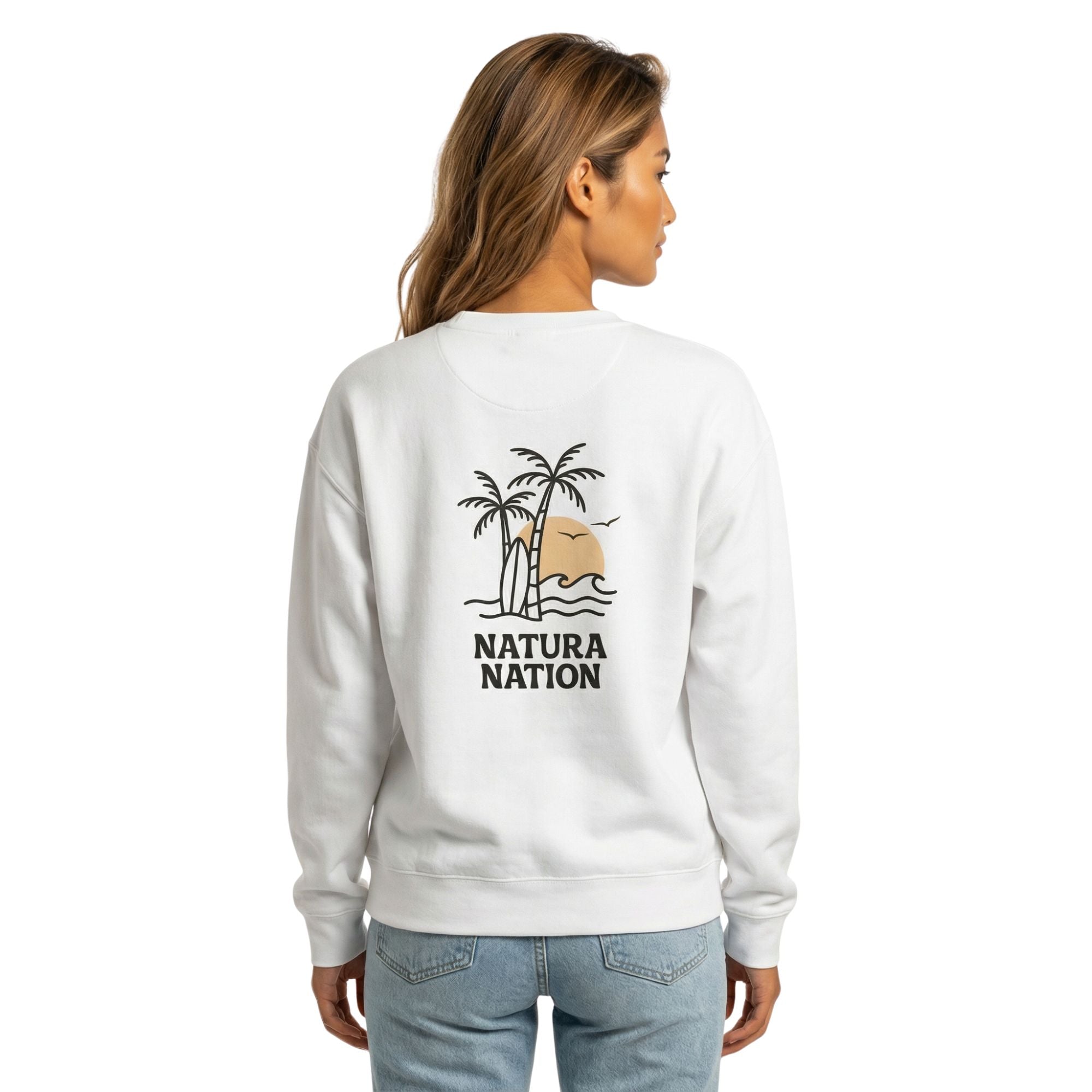 Female model wearing a comfortable white nature sweatshirt with the 'Tropical Dreams' graphic. Perfect Ocean Clothing for cozy, relaxed moments by the water by Natura Nation.