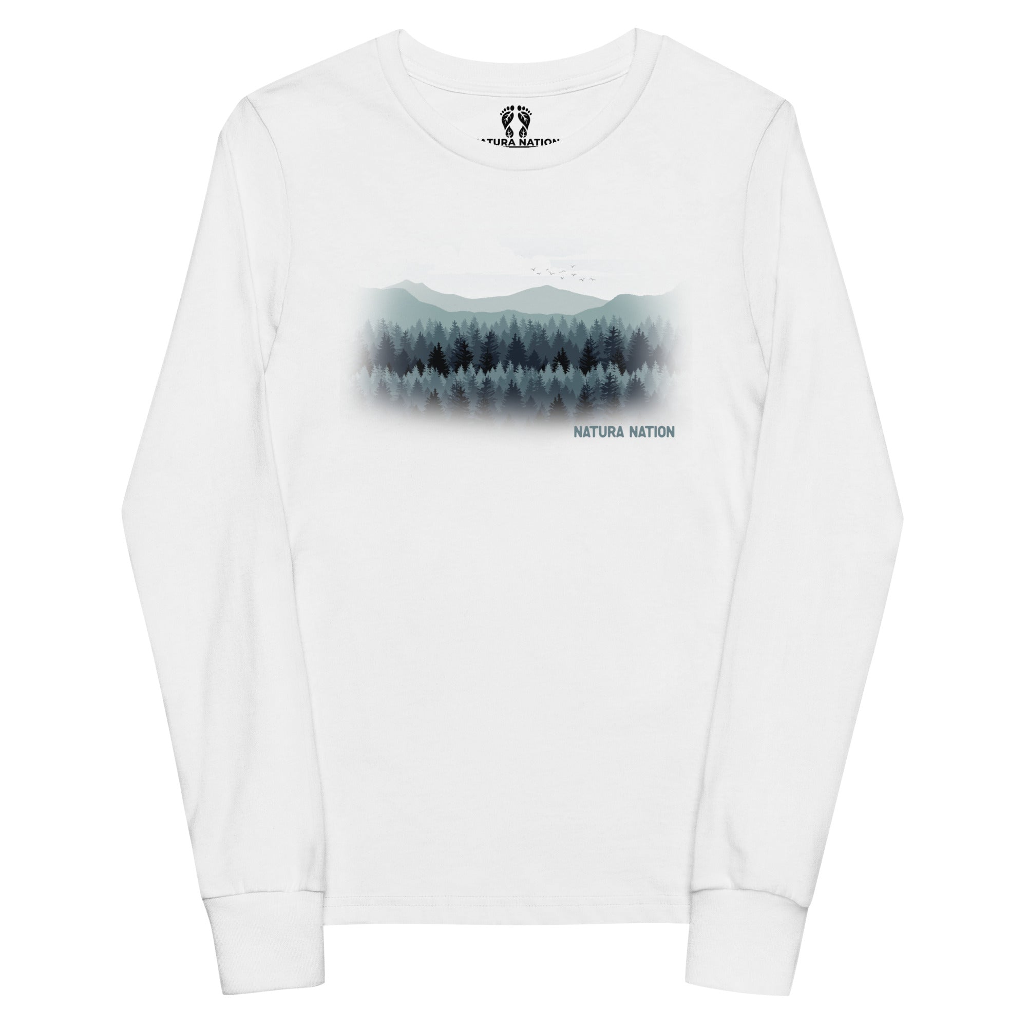 A white long-sleeve crewneck t-shirt featuring a central graphic of a misty pine forest and mountains in shades of green and gray, with the text 'NATURA NATION' printed below. Youth graphic long-sleeved T-shirt featuring pines and peaks, front view